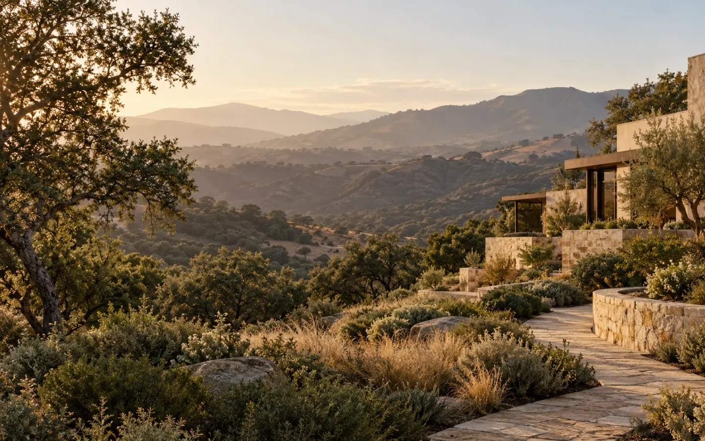Conceptual California landscape with warm stone architecture, oak trees and rolling hills