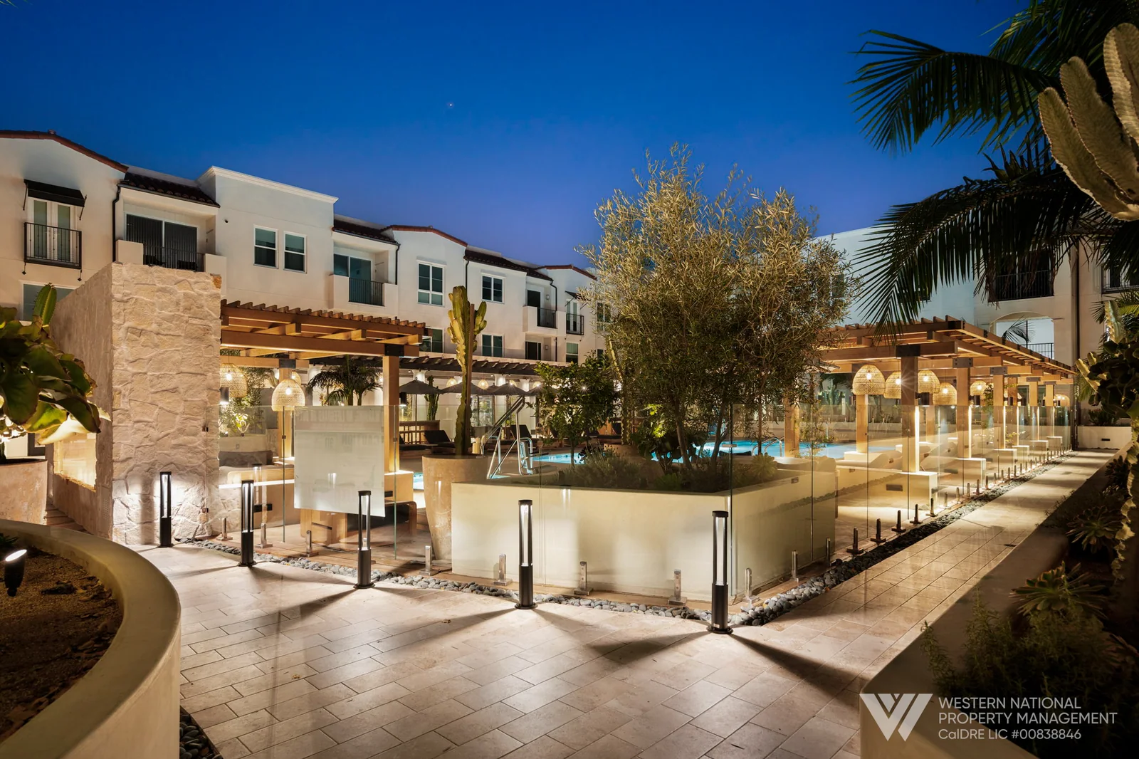 EDDY REDONDO RESIDENCES — Courtyard and pool at dusk